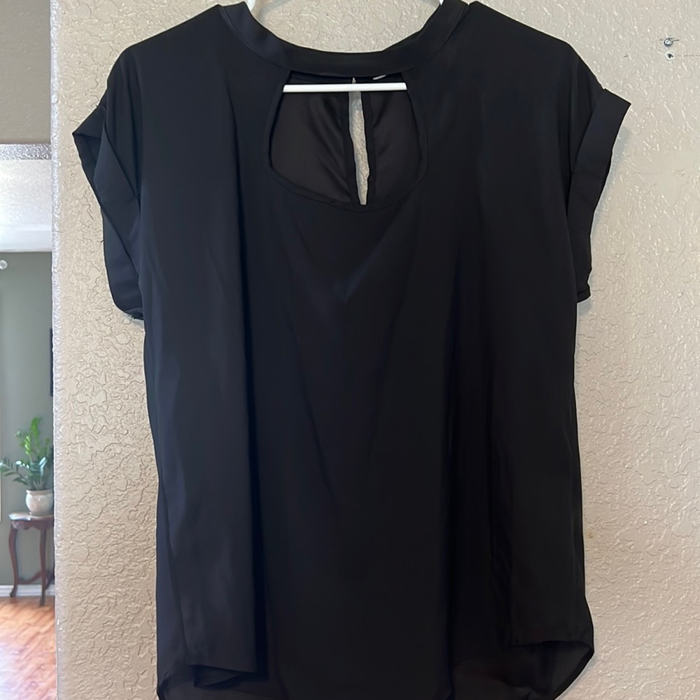 Women’s Black dress shirt.